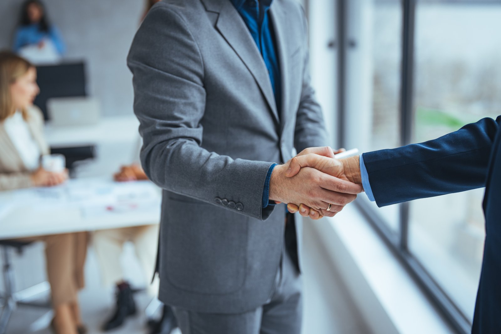 Professional handshake representing client relationships